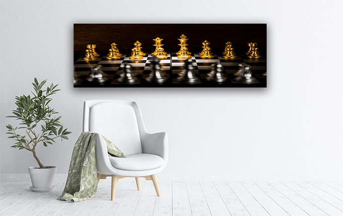 M4 0001 MP 0004 32130824 gold chess pieces on a chessboard business strategy concept AOAY1480