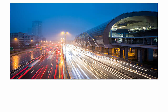 M1 0016 MOCKUPs 0013 32633674 traffic with light trail next to the train station during blue hour AOAY4597