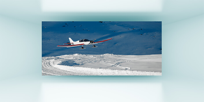 WEB002_0030_MP__0002_8200628_Snowplane landing in the mountains AOAY7221