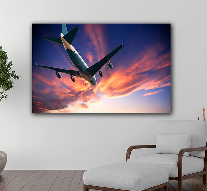 WEB005 0009 ML 0008 46061266 airplane flying in a cloudy sunset AOAY5275