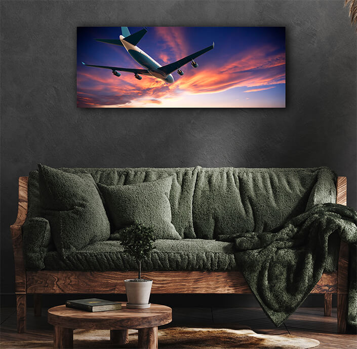 WEB007 0011 ML 0008 46061266 airplane flying in a cloudy sunset AOAY5275