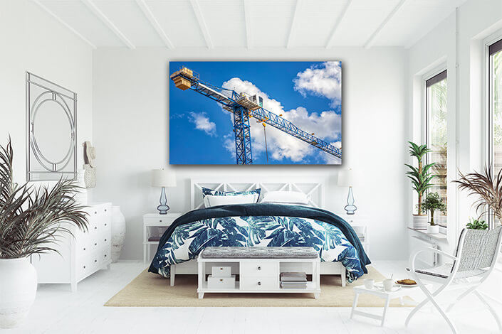 WEB007 0032 ML 0004 46516938 construction tower crane with a cabin on blue sky with clouds bottom view AOAY4811