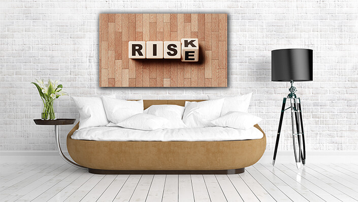 WEB004 0025 MP 0008 48167738 risk and rise wooden block cube on laminate floor financial risk management AOAY6172