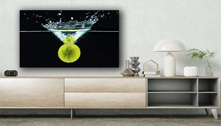 WEB003 0037 ML 0009 43091334 tennis ball falling in water with a splash against dark background AOAY5716